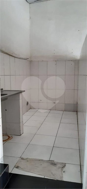 Imóvel com duas casas construídas, totalizando 96 m², na Rua Tanque Velho.