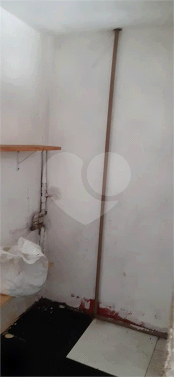 Imóvel com duas casas construídas, totalizando 96 m², na Rua Tanque Velho.