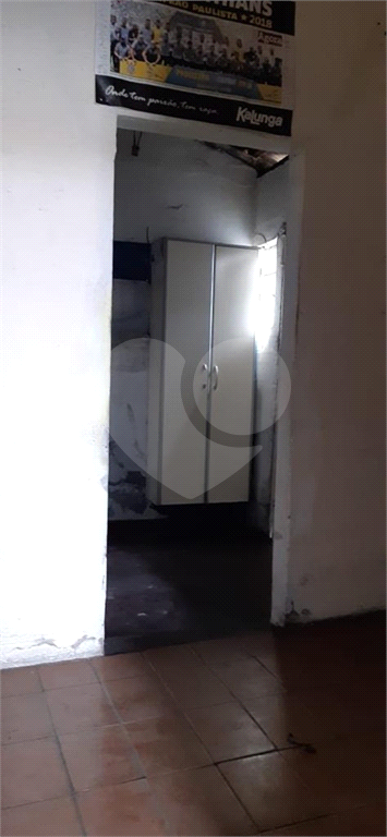 Imóvel com duas casas construídas, totalizando 96 m², na Rua Tanque Velho.