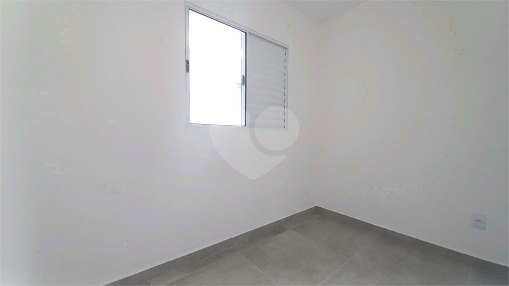 Apartamento à venda no Mandaqui localizado no térreo com um pequeno quintal.