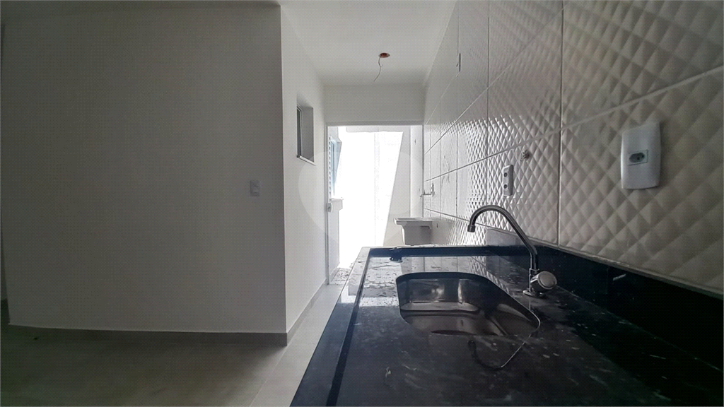 Apartamento à venda no Mandaqui localizado no térreo com um pequeno quintal.