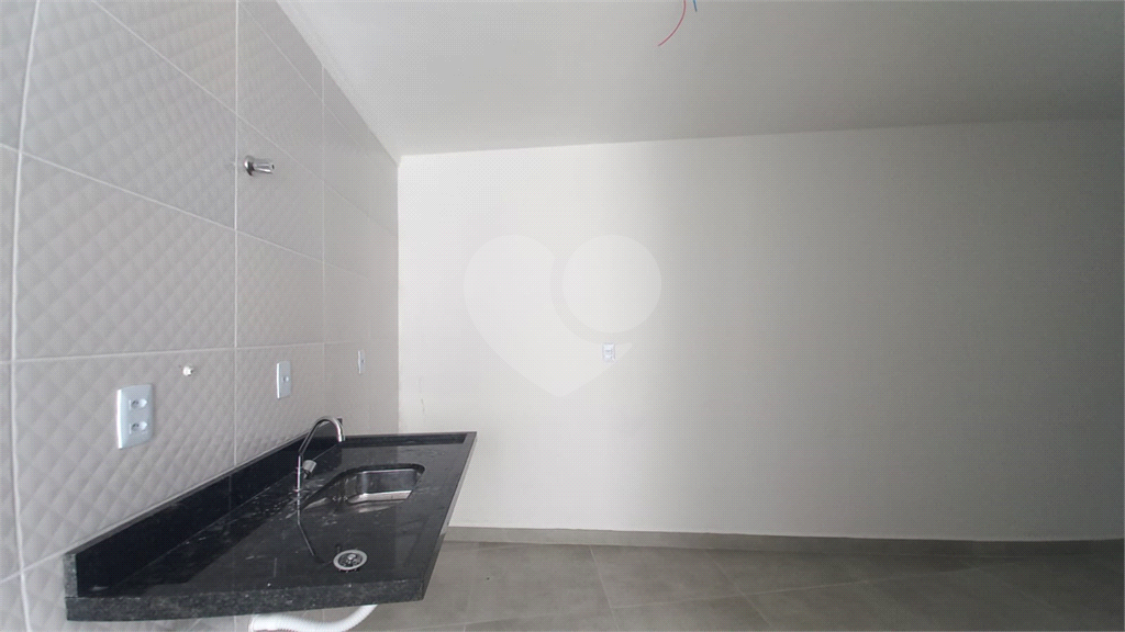 Apartamento à venda no Mandaqui localizado no térreo com um pequeno quintal.