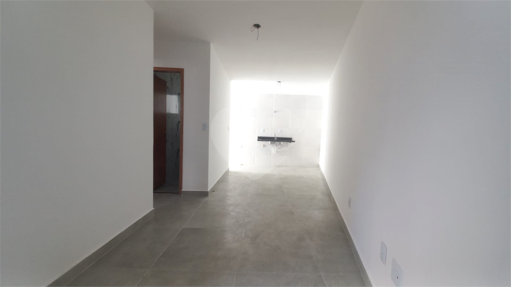 Apartamento à venda no Mandaqui localizado no térreo com um pequeno quintal.