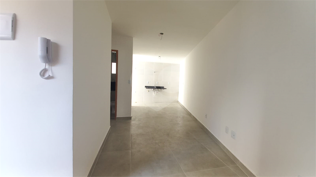 Apartamento à venda no Mandaqui localizado no térreo com um pequeno quintal.