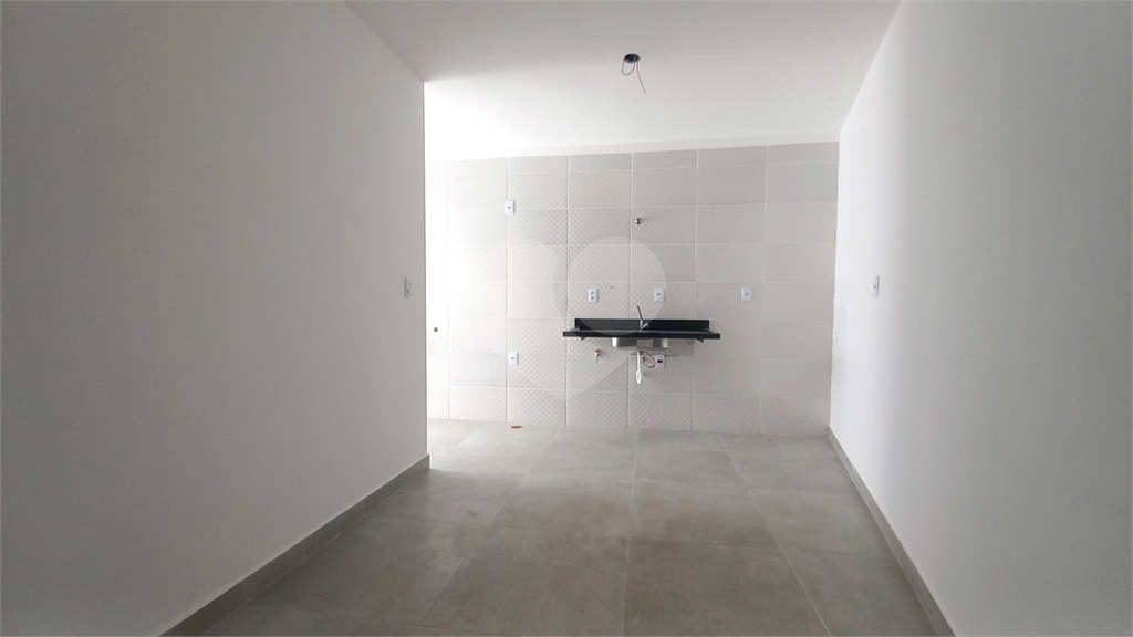 Apartamento à venda no Mandaqui localizado no térreo com um pequeno quintal.