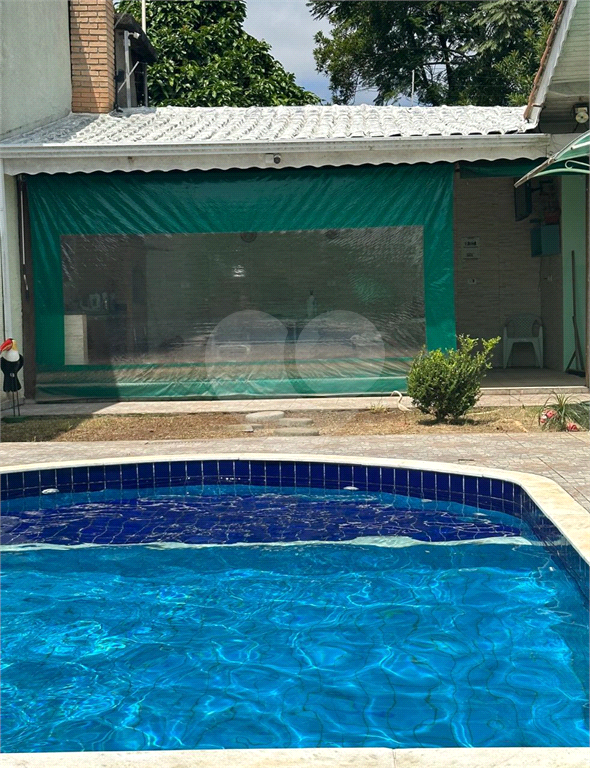 Casa térra com 3 dormitórios, 2 suítes, área gormet, piscina e 7 vagas
