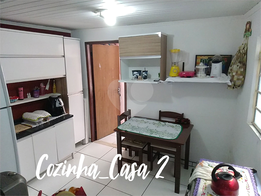 Terreno com 3 casas construídas no Jaraguá