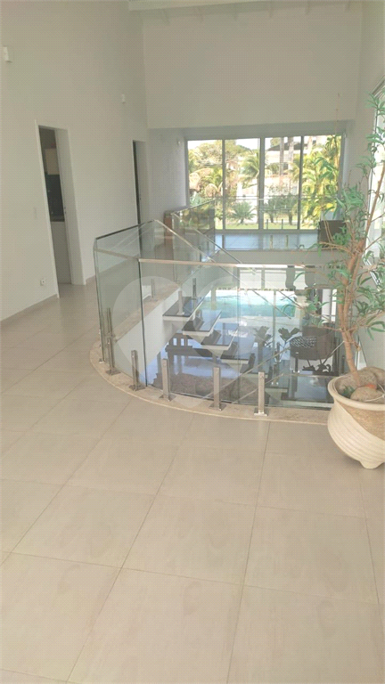 Sobrado em condomínio com 350m² à venda em Riviera de São Lourenço - 4 suítes e 3 vagas