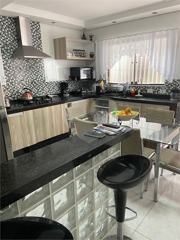 Casa à venda em Santo André, na Vila Suíça, 2 dormitórios (1 suíte), 2 vagas, quintal, churrasqueira